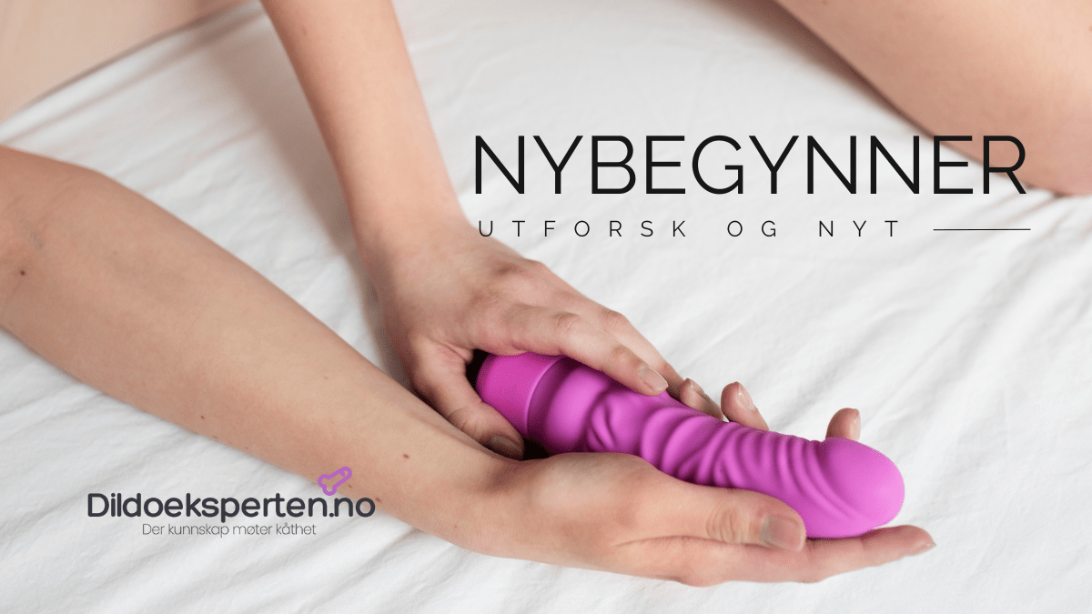 Dildo for nybegynner, kvinnehender holder en rosa dildo.